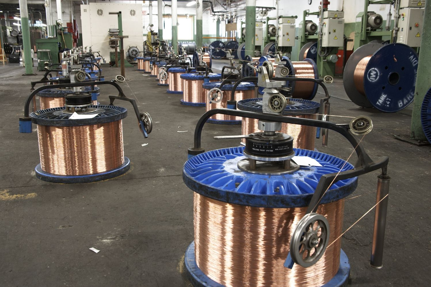 Close-up of spooled wire in a manufacturing setting